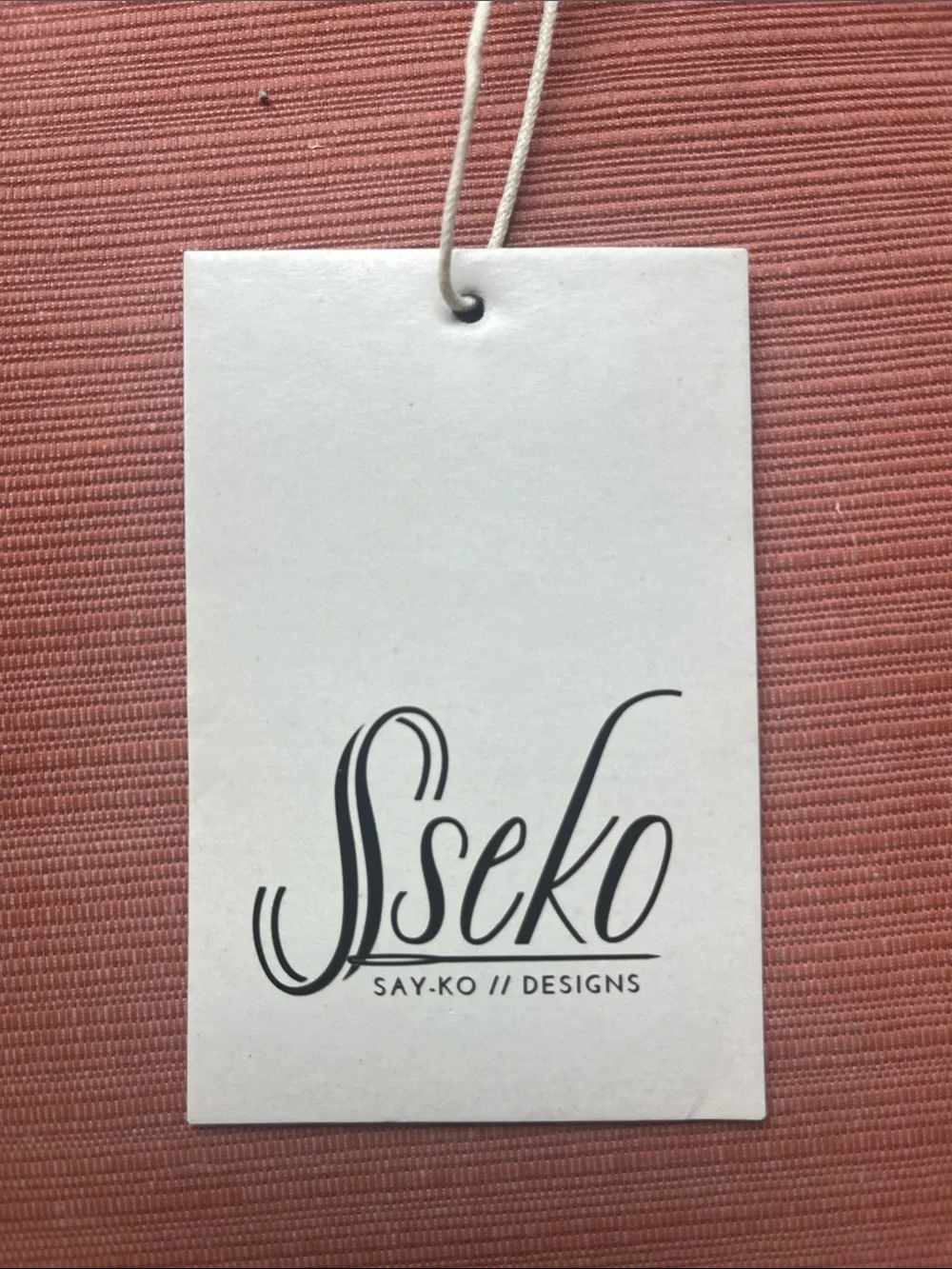 Sseko Pink and Natural Brown Handheld Wooden Scoop